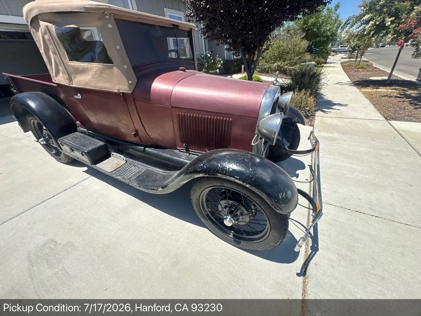 Late-1920s Ford Model A roadster pickup at pickup-condition inspection in a Hanford, California driveway