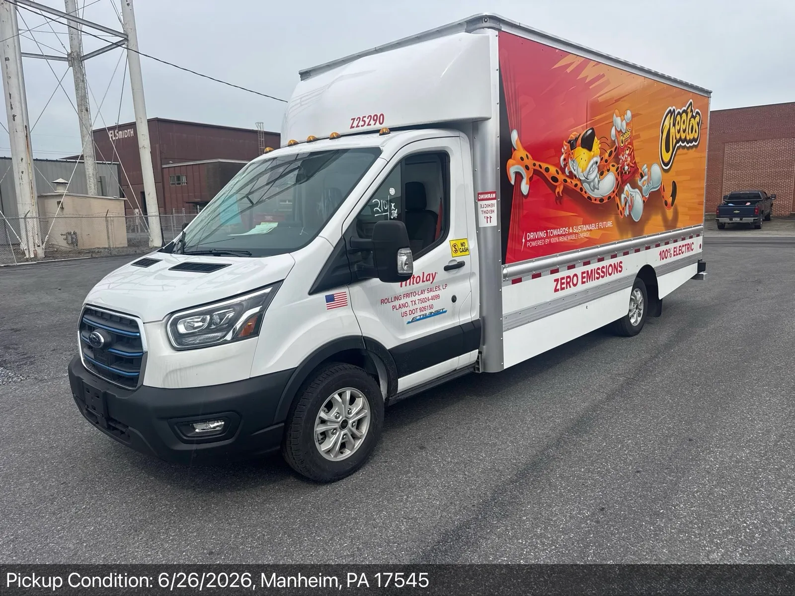 Wrapped Ford E-Transit electric box truck at pickup-condition inspection in Manheim, Pennsylvania
