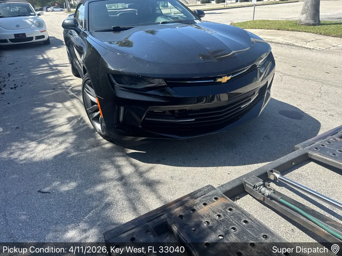 Chevrolet Camaro being loaded onto a carrier in Key West, FL