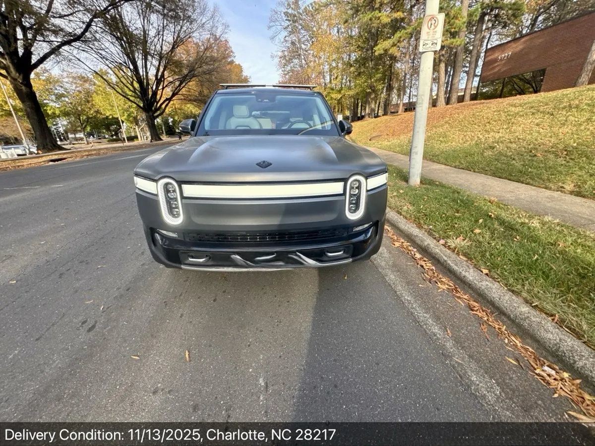 Front view of a charcoal Rivian R1T at delivery in Charlotte, NC
