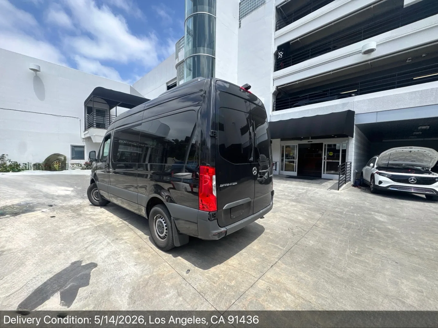 High-roof Mercedes Sprinter delivered at a Los Angeles dealership, rear view with Sprinter badge