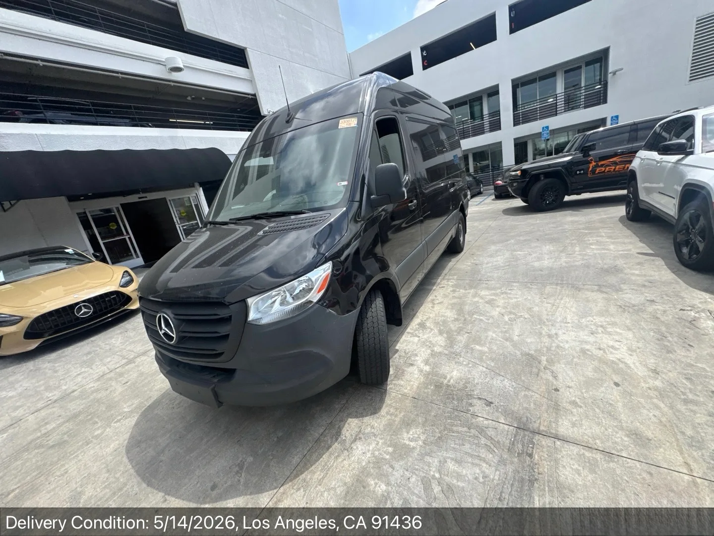 Black high-roof Mercedes-Benz Sprinter van delivered to a Los Angeles dealership