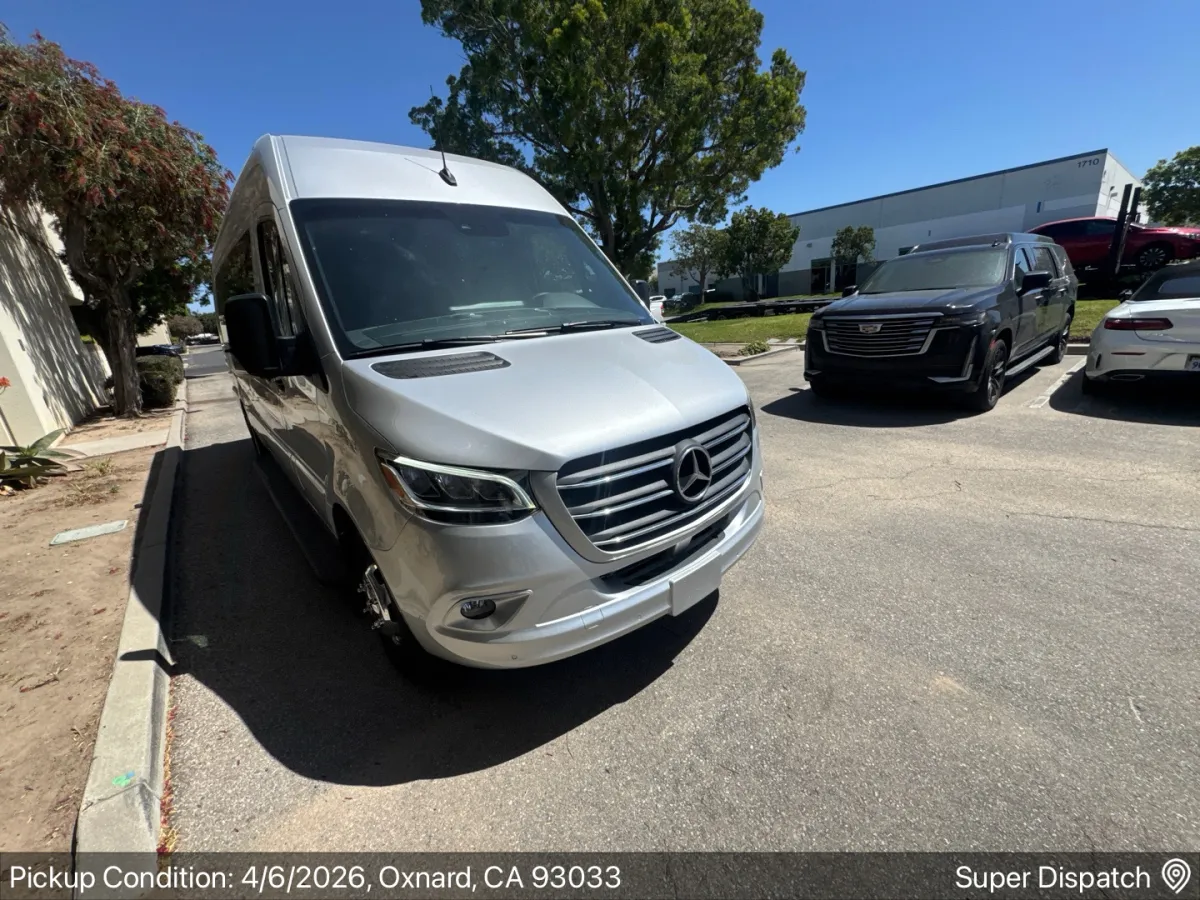 Silver Mercedes Sprinter van ready for auto transport pickup