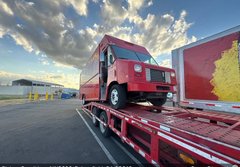 Enclosed auto transport carrier loaded
