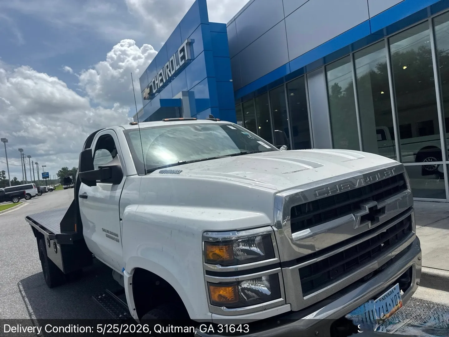 Chevrolet Silverado flatbed work truck delivered to a dealership in Georgia